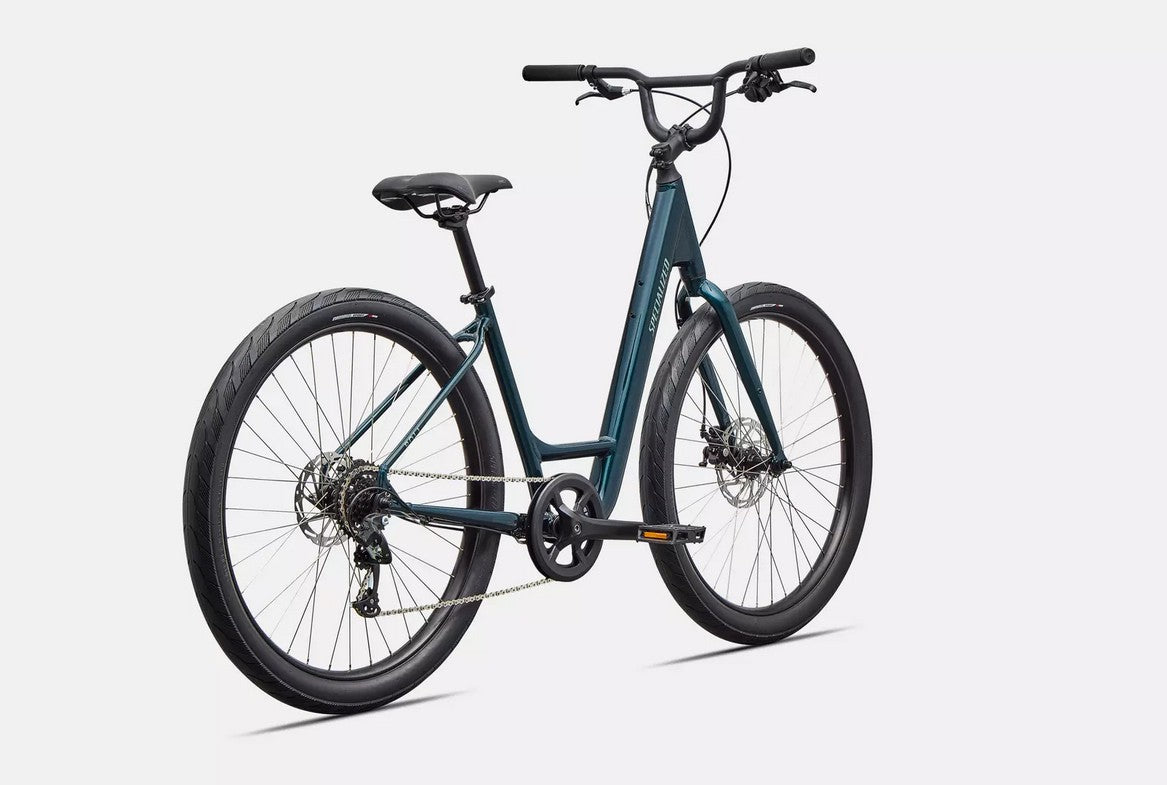 Back right profile view of emerald green Specialized Roll bicycle on white background.
