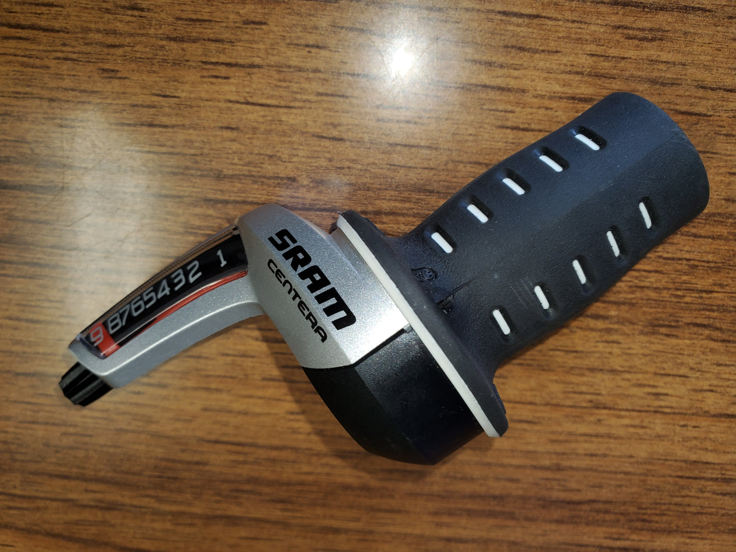 SRAM Centera twist shifter for bicycles, showing the side view with the brand name and gear ratio details.