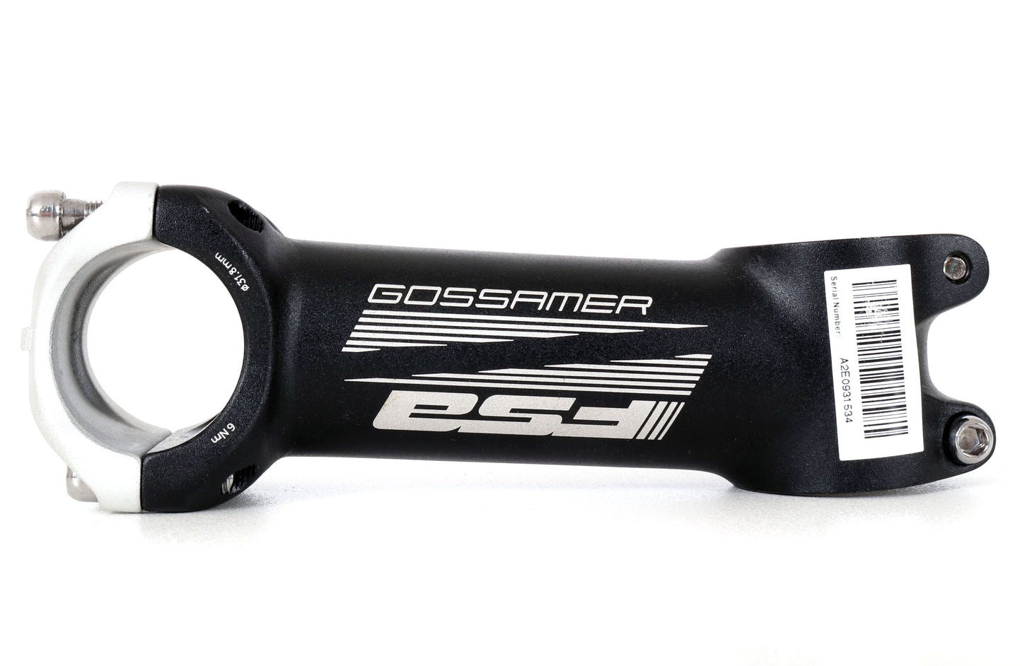 Side view of a black bicycle stem with words FSA Gossamer along the side, front stem plate is silver