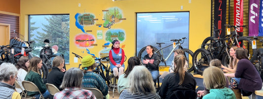 Panelists at the Get the Gals Riding Event discuss topics with a group of female cyclists at the Hostel Shoppe.