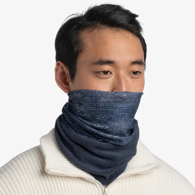 Image of the Buff Polar Neckwear in Katic Blue on a model's neck and lower face against a white background.