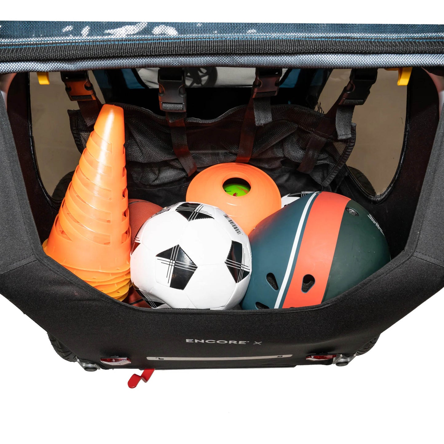 Rear view of the Burley Encore X Child Trailer in Blue, showing the cargo area  filled with sporting equipment, shown on a white background.