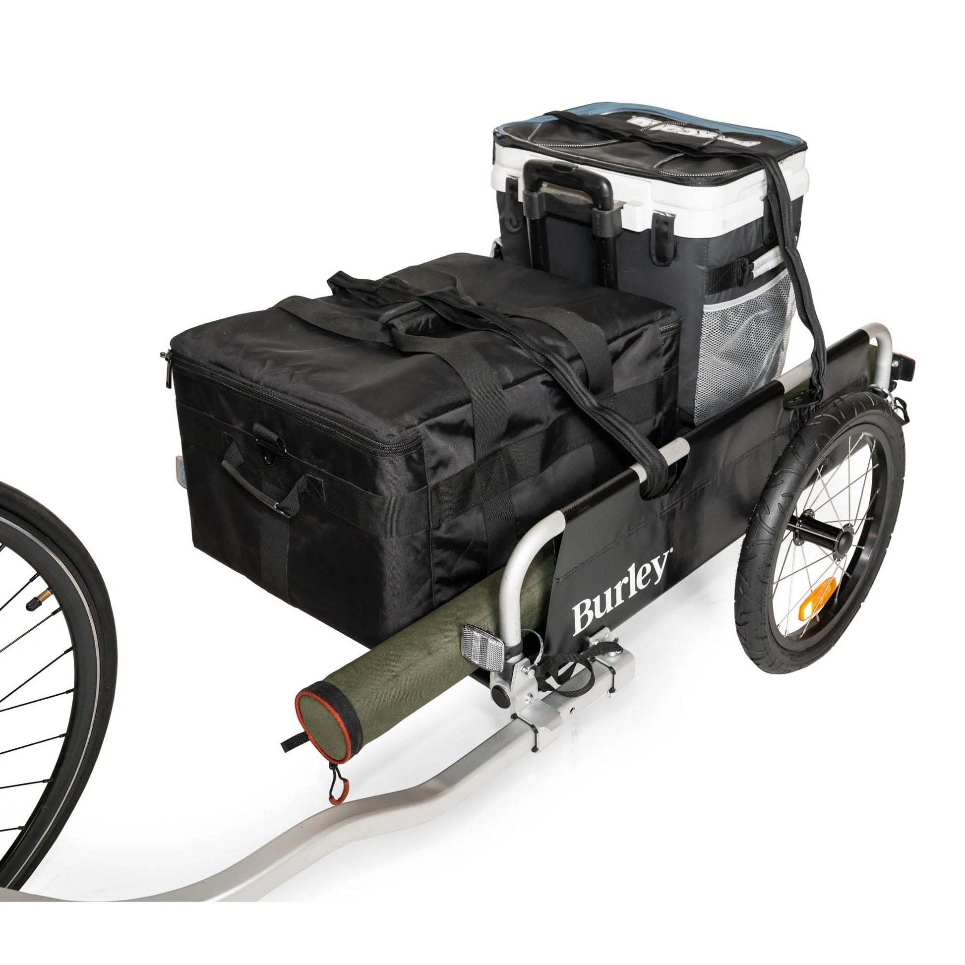 Front quarter view of the Burley Flatbed Cargo Trailer, packed with cargo and coolers, on a white background.