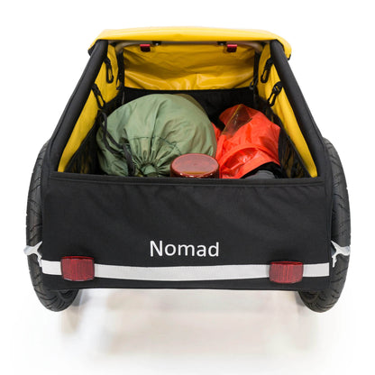 Overhead view of the Burley Nomad Cargo Trailer, shown with the cover open filled with cargo, on a white background.