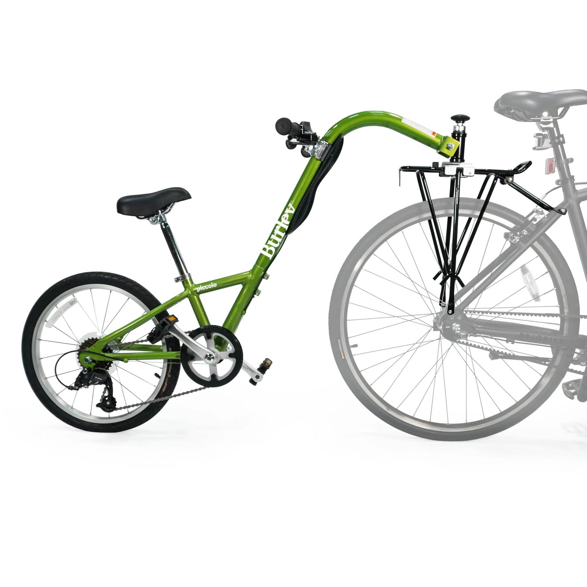 Side view of the Burley Piccolo Trailer Cycle in Green, shown mounted to a bicycle, on a white background.