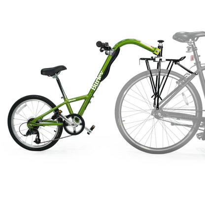 Side view of the Burley Piccolo Trailer Cycle in Green, shown mounted to a bicycle, on a white background.