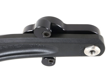 The back view of a pair of CJ Ackley Machine Company Wide Crank Arm Shorteners in black mounted on a crank arm.