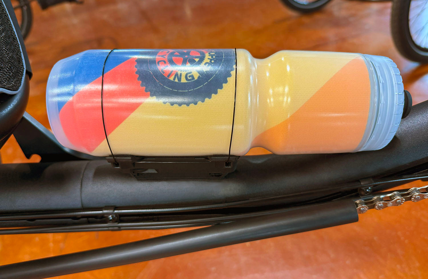 Fidlock Uni Connector for BottleTwist Water Bottle, side view, shown mounted on trike