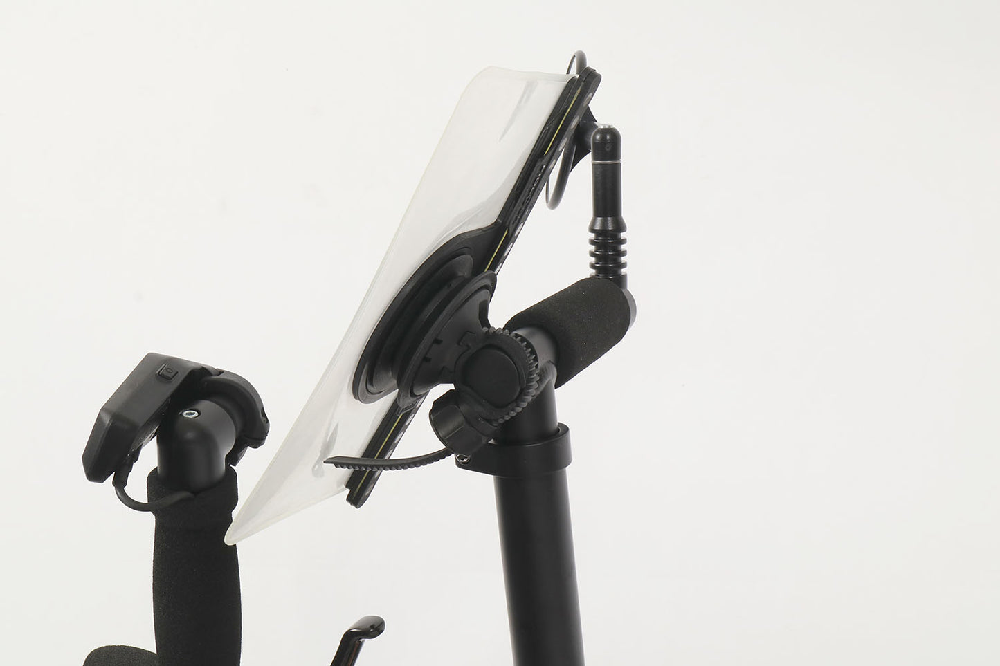 Studio side profile view of a Fidlock VACUUM Handlebar Base Flex mount installed on a stand-up aid of a recumbent trike