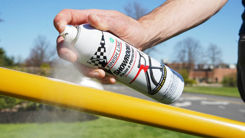 Finish Line Showroom Ceramic Polish and Protectant 12oz Aerosol being used to clean bike frame