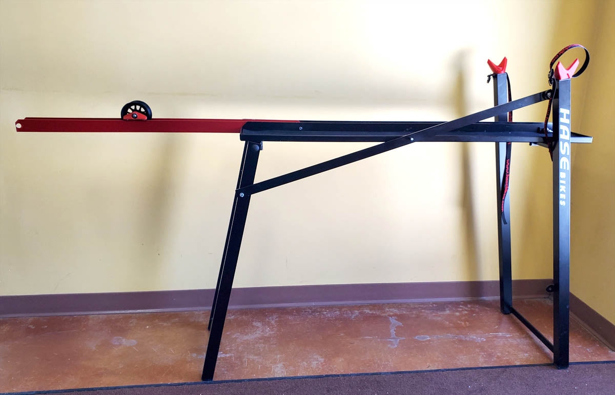 Black and red Hase work stand for recumbent trikes.