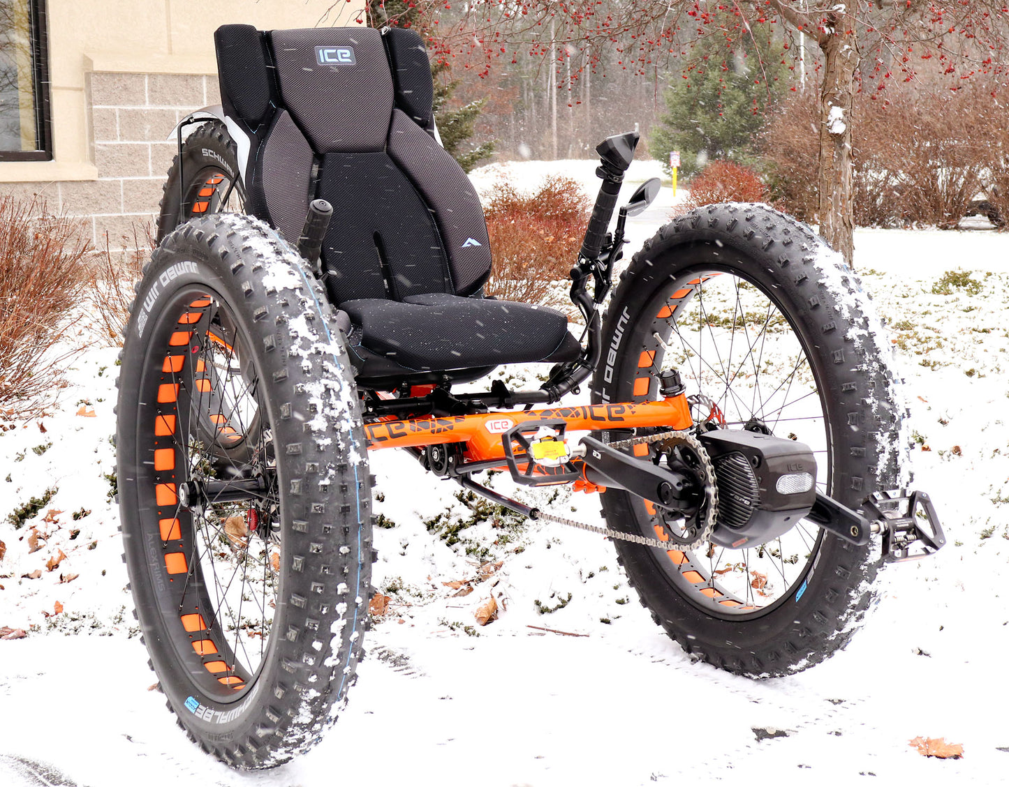 Front right angle view of ICE full fat recumbent trike in the snow