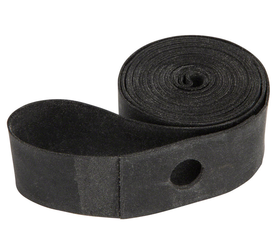 Studio image of a black rubber rim strip rolled up with the hole for the valve stem of a tube exposed. 