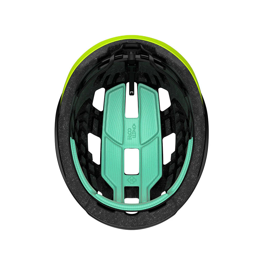 Studio inside view of a helmet with black foam and mint green padding. 