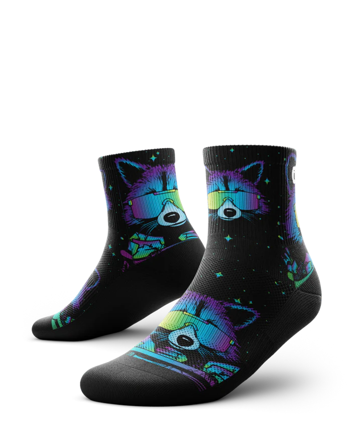 Pair of black sock with heads of racoons wearing sunglasses and garbage cands.  Racoons and garbage cans are blues, purples, teals, and yellows, background is black.