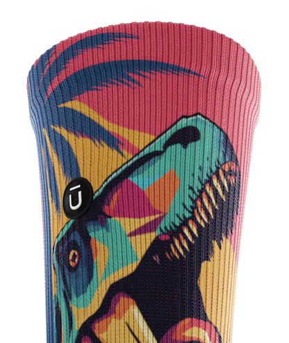 Top cuff of multicolored sock with T-rex and palm trees.  Small black circular patch with Outway logo on top third of sock.