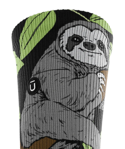 Top of cuff view of sock with sloths in trees on main part of sock. Small black circular patch with Outway logo on top third of cuff. 