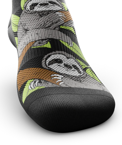 Top toe view of sock with sloths in trees on main part of sock