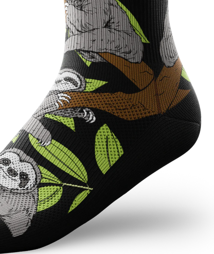 Side ankle view of sock with sloths in trees on main part of sock