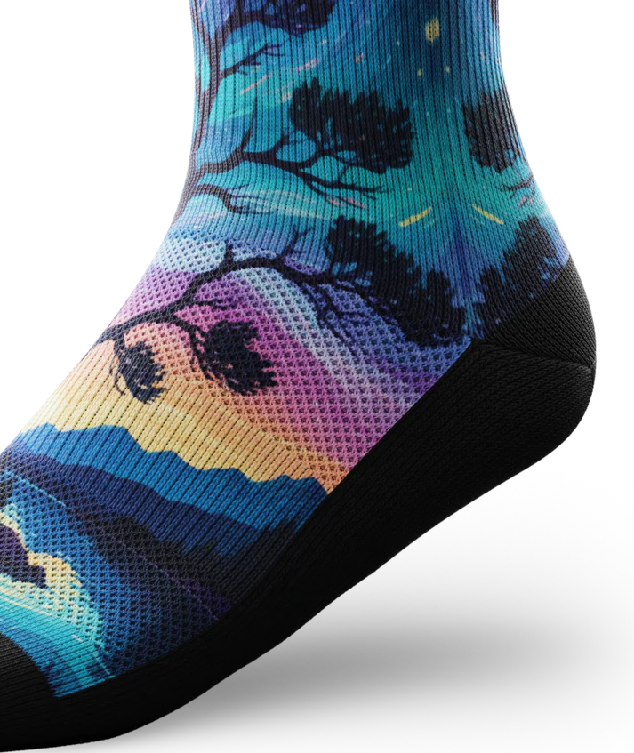 Ankle view of multicolored sock with colorful northern lights in the ski over a mountain lake with trees silhouetted.  