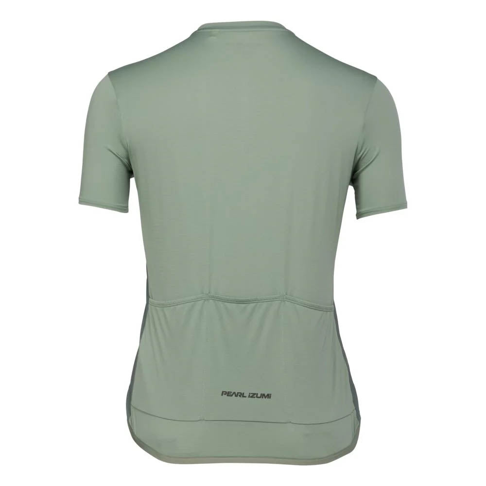 Studio image of the Pearl Izumi Sugar Jersey showing three open pockets across the lower back and dark green lettering that says Pearl Izumi at the base of the middle pocket. 