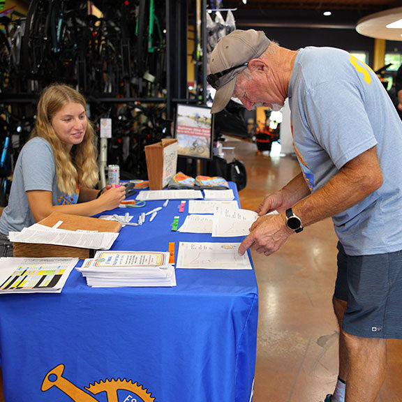 A rider registers for the Pedal Point Rally at day-of-registration.