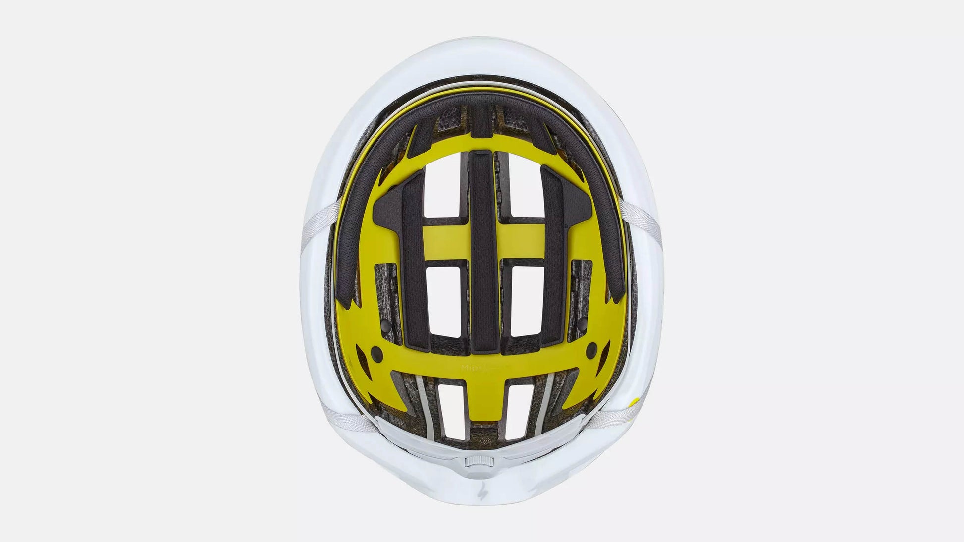 Specialized Loma white bicycle  underside studio image showing yellow MIPS lining and black padding. 