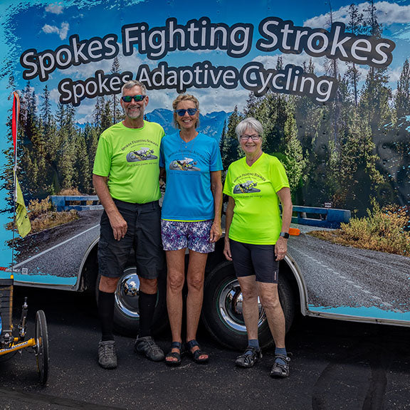 Dan Zimmerman and crew post in front of the Spokes Fighting Strokes trailer.
