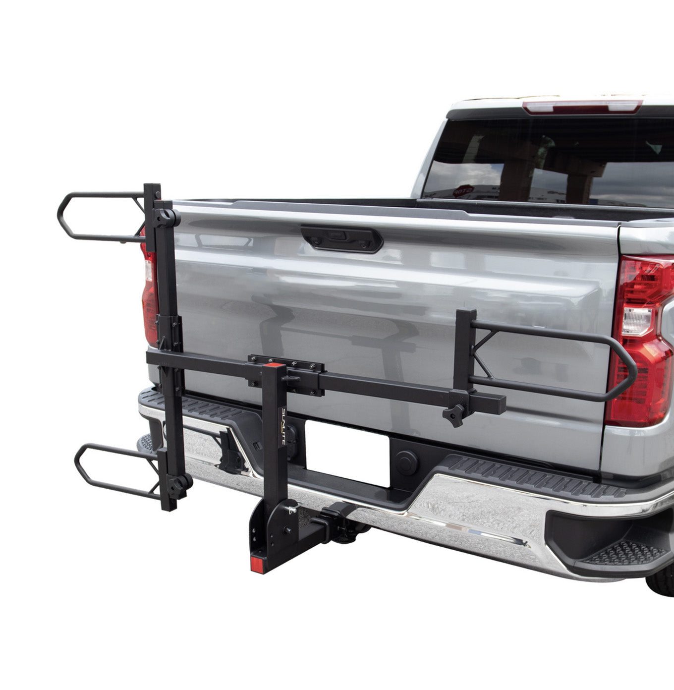 Folded up view of the Sunlite HRT-100 Trike Auto Rack for 2-inch Receivers mounted on the hitch on a pickup truck against a white background.