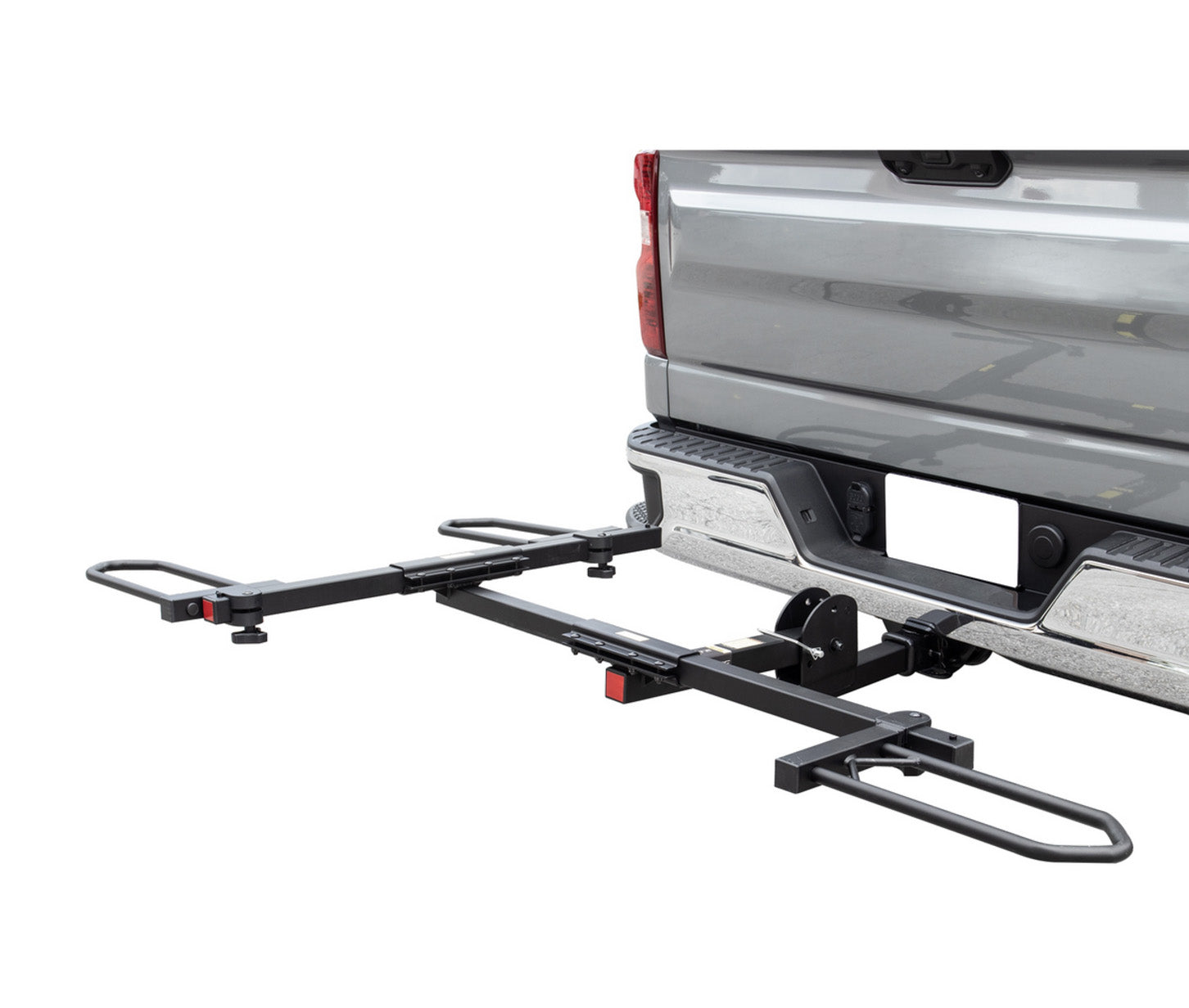 View of the Sunlite HRT-100 Trike Auto Rack for 2-inch Receivers mounted on the hitch on a pickup truck against a white background.