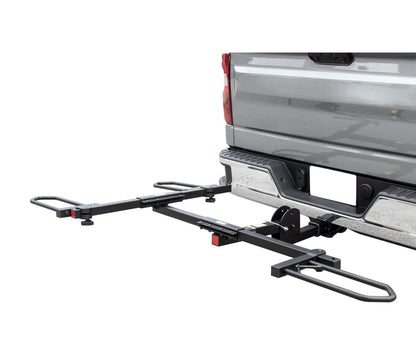 View of the Sunlite HRT-100 Trike Auto Rack for 2-inch Receivers mounted on the hitch on a pickup truck against a white background.