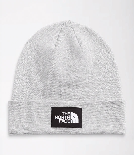 Studio image of light grey cuffed beanie with black and white The North Face logo patch in center of cuff. 