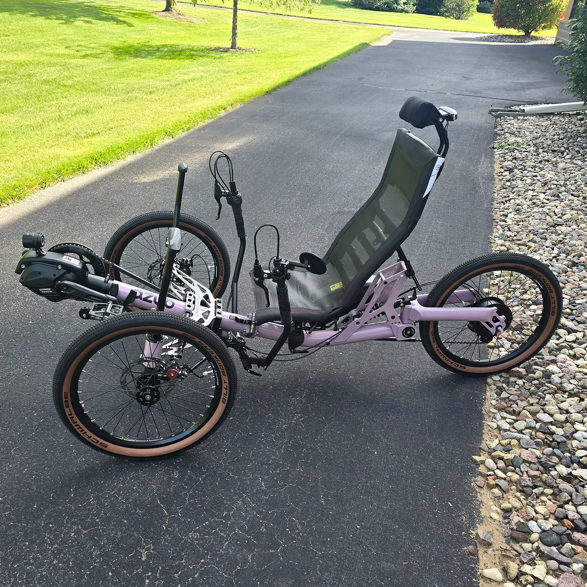 Non-drive side view of the Azub Demo Ti-Fly 20 Enviolo Shimano EP6 Pastel Violet Recumbent Trike in an outdoor setting.