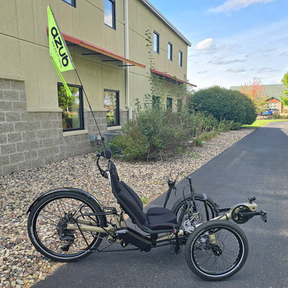Side view of the Azub Demo Ti-Fly 26 Bosch Performance CX Dark Sand Recumbent Trike in an outdoor setting.