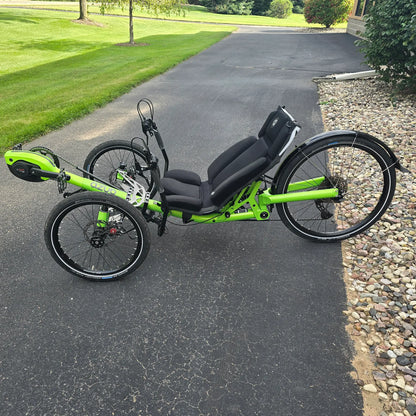 Non-drive side view of the Azub Demo Ti-Fly 26 Bosch Performance CX Lime Green Recumbent Trike in an outdoor setting.