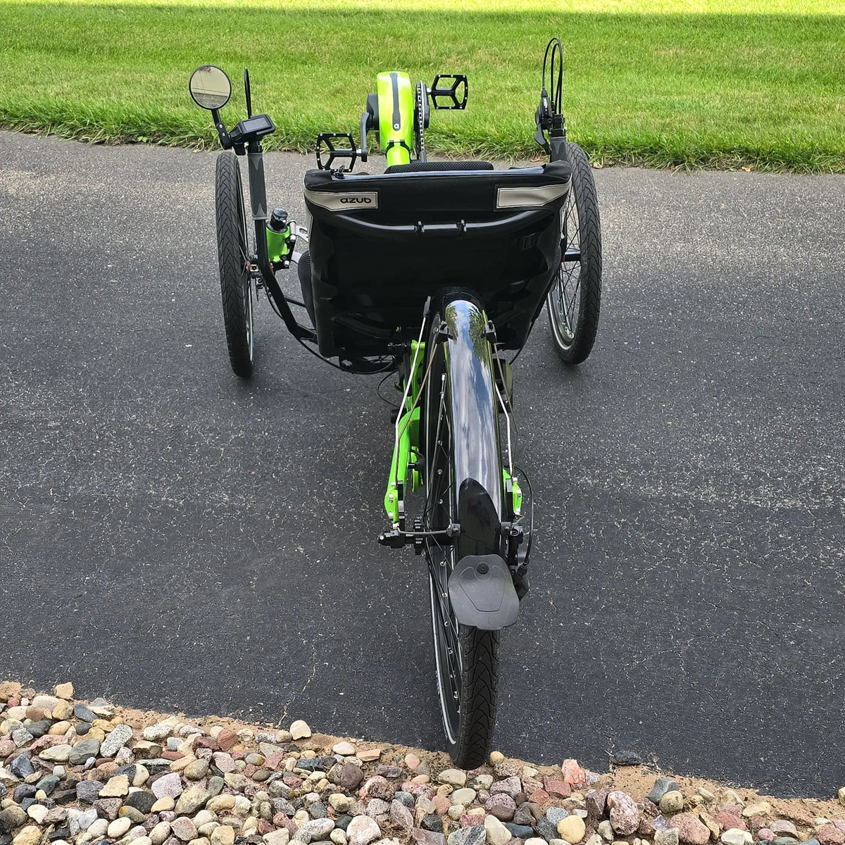 Rear view of the Azub Demo Ti-Fly 26 Bosch Performance CX Lime Green Recumbent Trike in an outdoor setting.