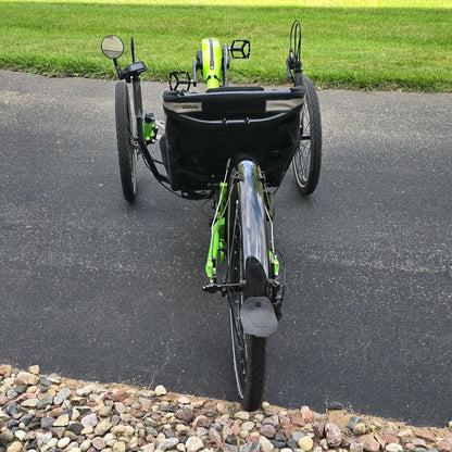 Rear view of the Azub Demo Ti-Fly 26 Bosch Performance CX Lime Green Recumbent Trike in an outdoor setting.