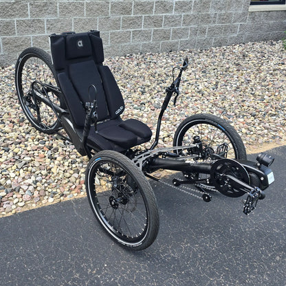 Angled side view of the Azub Demo Ti-Fly 26 Shimano EP6 Deep Black Recumbent Trike in an outdoor setting.