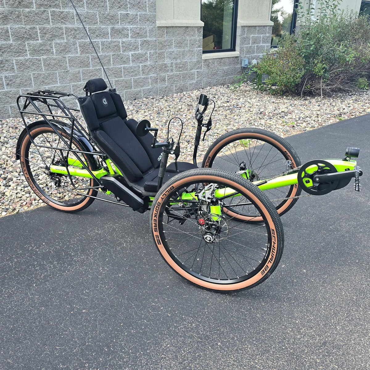 Anlged side view of the Azub Demo Ti-Fly X Rohloff E14 Bosch Performance CX Dual Battery Lime Green Recumbent Trike in an outdoor setting.