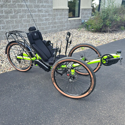 Anlged side view of the Azub Demo Ti-Fly X Rohloff E14 Bosch Performance CX Dual Battery Lime Green Recumbent Trike in an outdoor setting.
