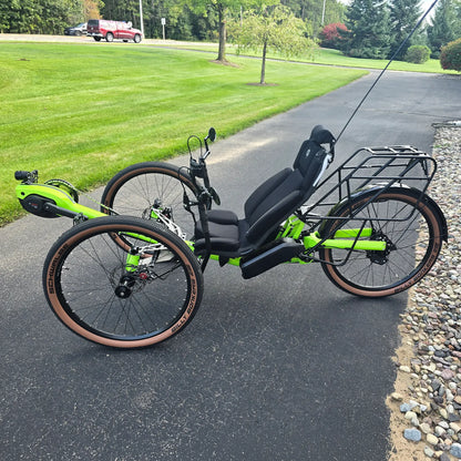 Non-drive side view of the Azub Demo Ti-Fly X Rohloff E14 Bosch Performance CX Dual Battery Lime Green Recumbent Trike in an outdoor setting.