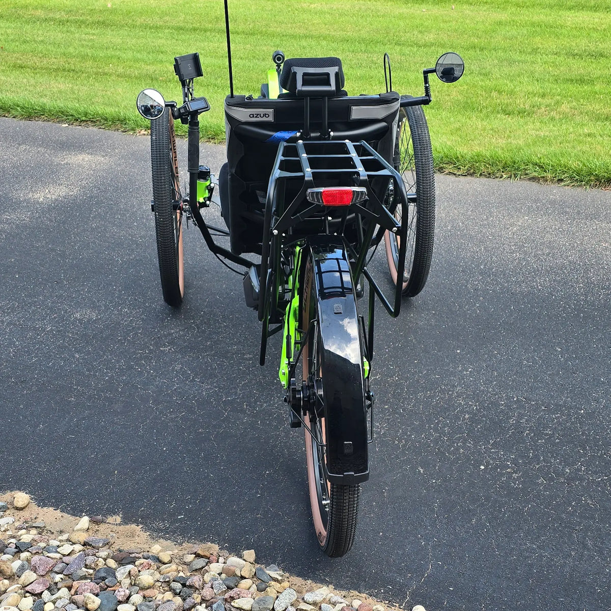 Rear view of the Azub Demo Ti-Fly X Rohloff E14 Bosch Performance CX Dual Battery Lime Green Recumbent Trike in an outdoor setting.