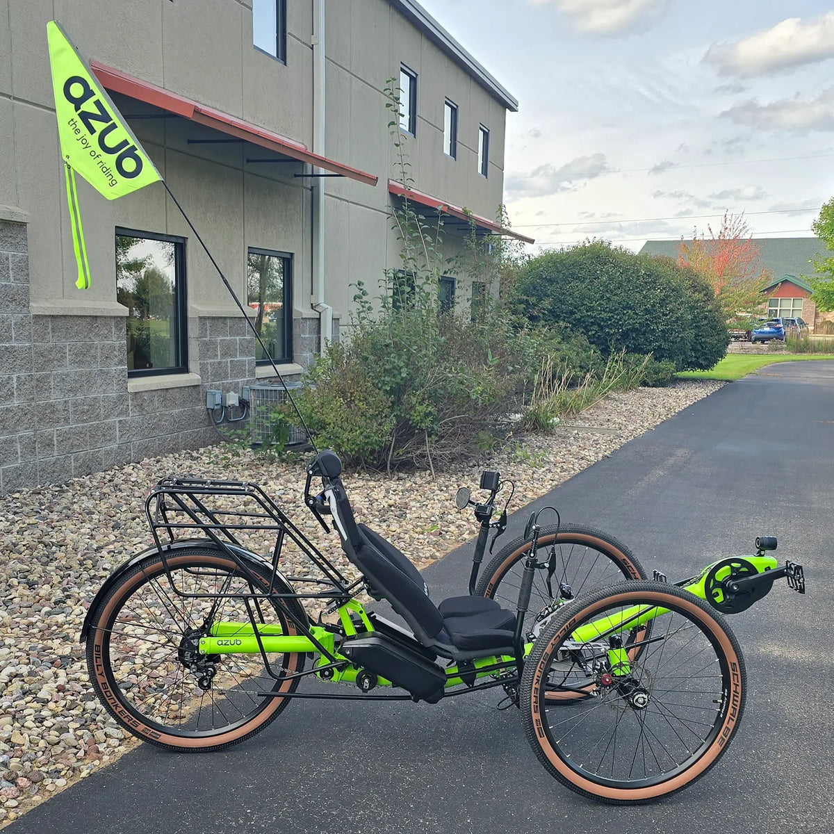 Side view of the Azub Demo Ti-Fly X Rohloff E14 Bosch Performance CX Dual Battery Lime Green Recumbent Trike in an outdoor setting.