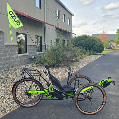 Side view of the Azub Demo Ti-Fly X Rohloff E14 Bosch Performance CX Dual Battery Lime Green Recumbent Trike in an outdoor setting.