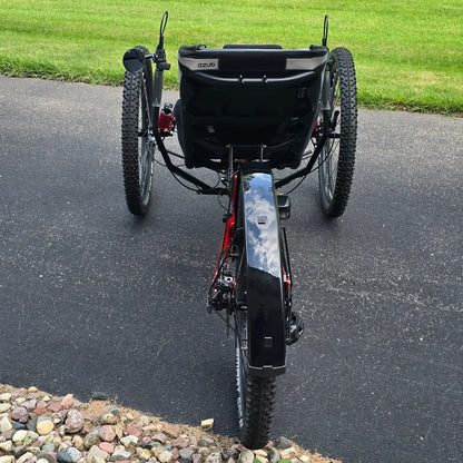 Rear view of the Azub Demo Ti-Fly X Shimano EP6 Ruby Red Recumbent Trike in an outdoor setting.