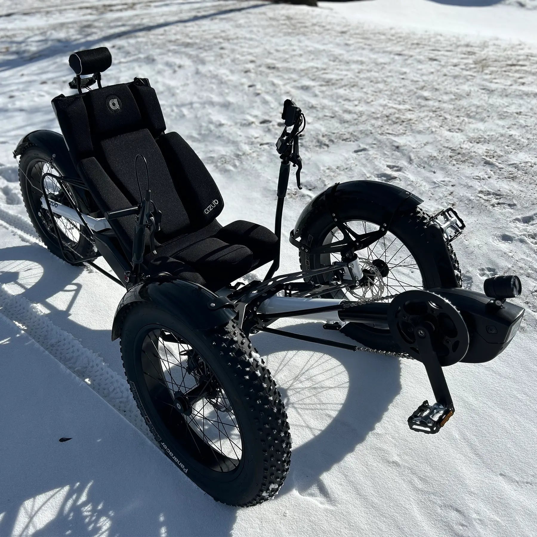 Azub Limited Edition Ti-Fly recumbent trike on a snowy path.
