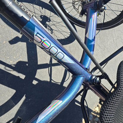 Closeup view of the frame on the Azub Used T-Tris 5000 Chameleon Teal Custom Recumbent Trike in an outdoor setting.