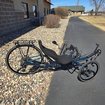 Side view of the Azub Used T-Tris 5000 Chameleon Teal Custom Recumbent Trike in an outdoor setting.