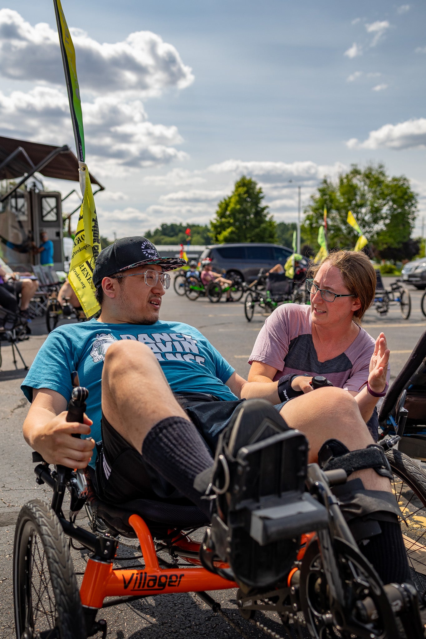 Hostel Shoppe owner, Breanna, talks with a customer about a recumbent trike.