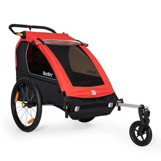 Front quarter view of the Burley Honey Bee Double Child Trailer in Red, on a white background.